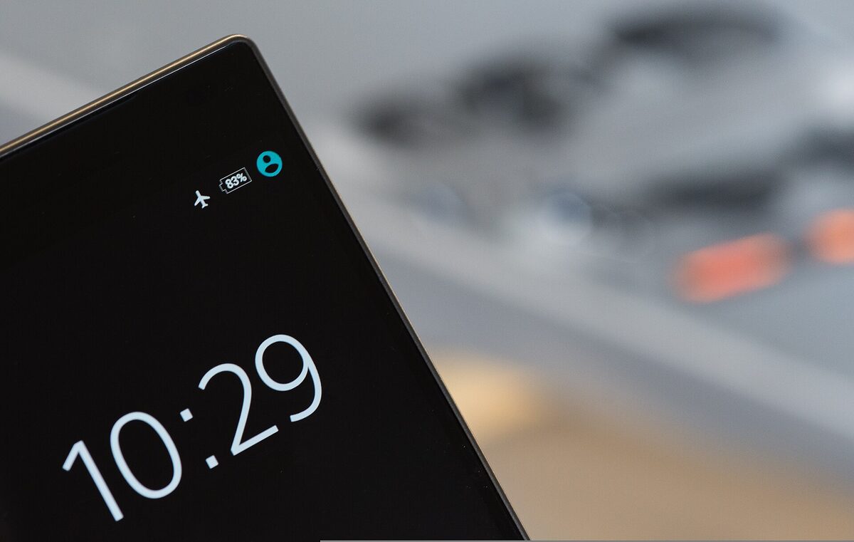 A phone resting in a hand — where a small glance becomes presence.