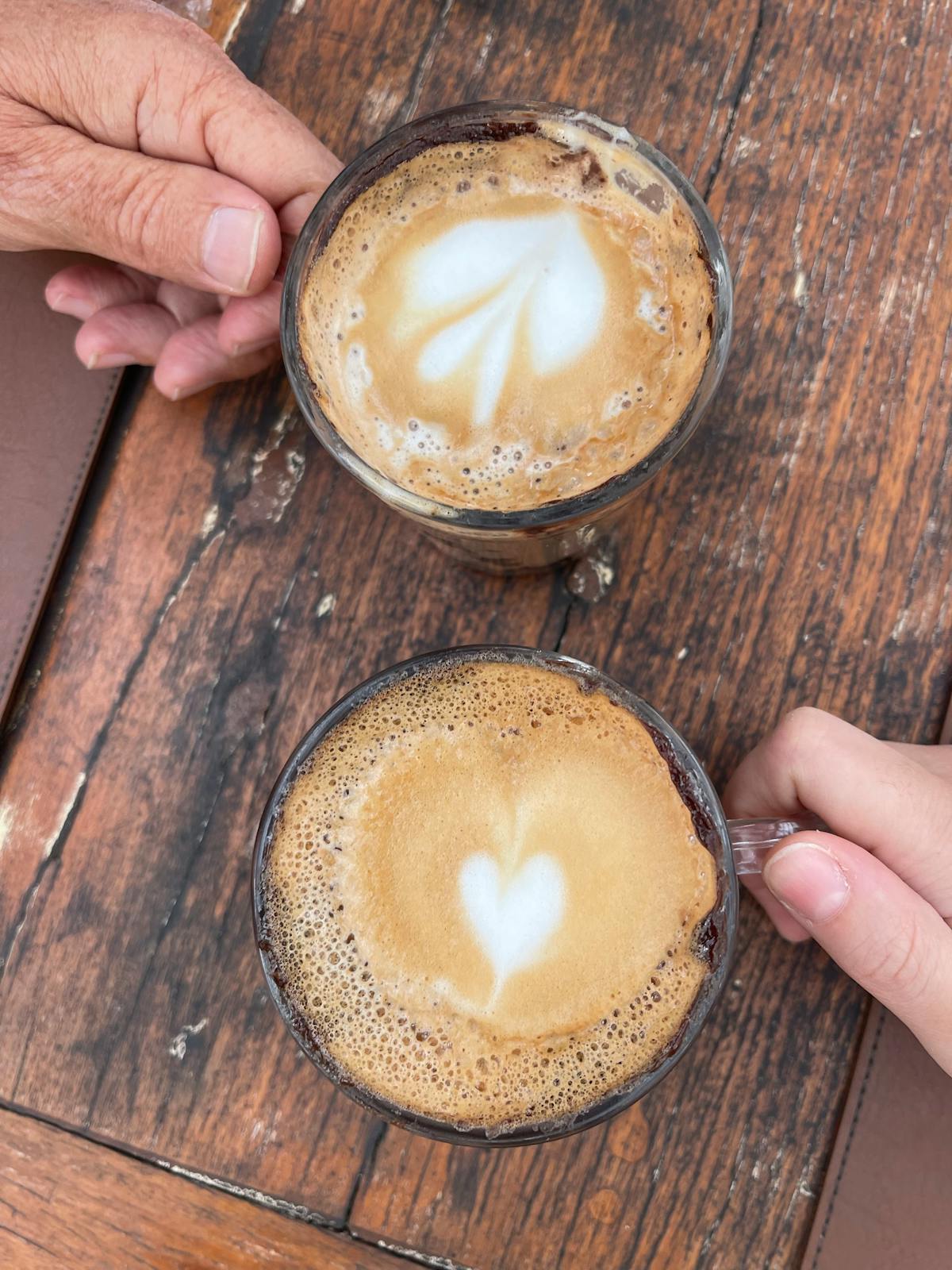 Two cups of coffee on a wooden table — built for two, just for you